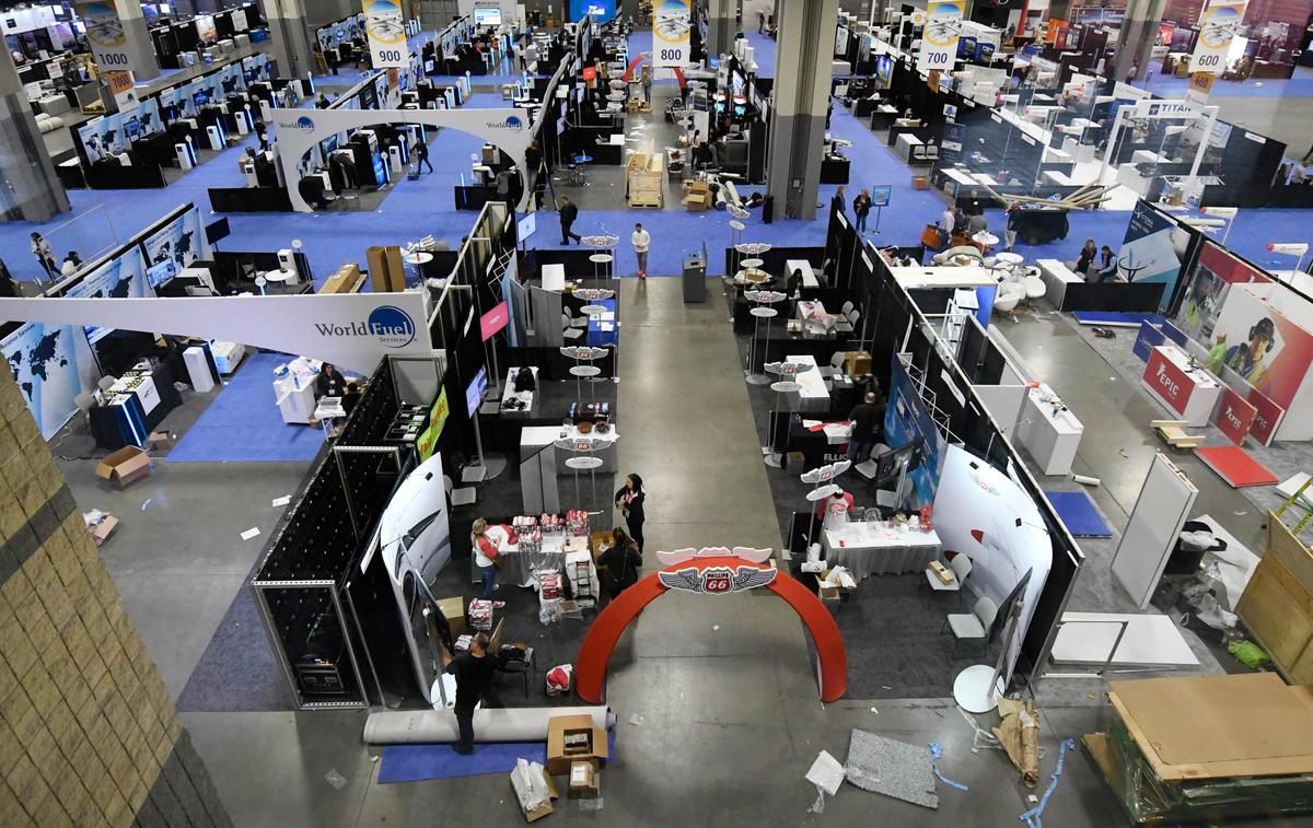 Attendees of the NBAA 2020 Schedulers & Dispatchers Conference (SDC2020) continue to assemble their exhibit area on the floor of the Charlotte Convention Center on Tuesday, March 10, 2020, in preparation of the convention which starts on Wednesday. Conventions across the nation are being cancelled or rescheduled in wake of spreading novel coronavirus.