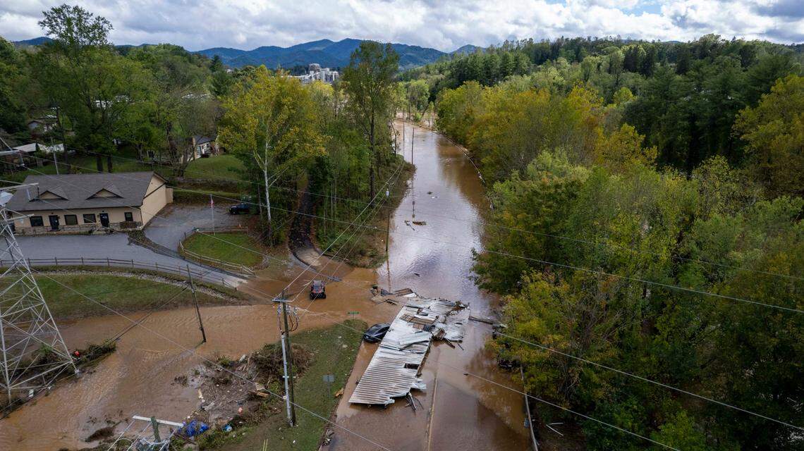 Foodwaters overrun a road in Canton on Friday, Sept. 27, 2024 as the remnants of Hurricane Helene caused flooding, downed trees, and power outages in western North Carolina.