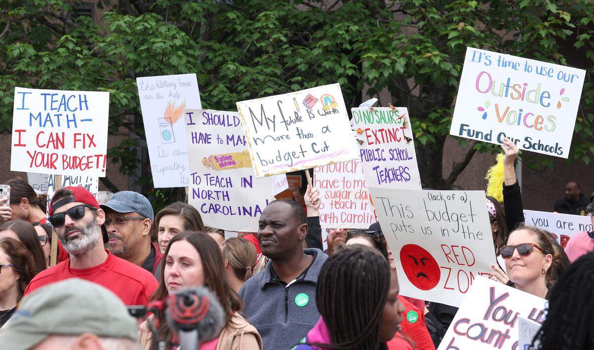 Signs, signs, signs were everywhere as teachers rallied at the Government Complex in Raleigh.
