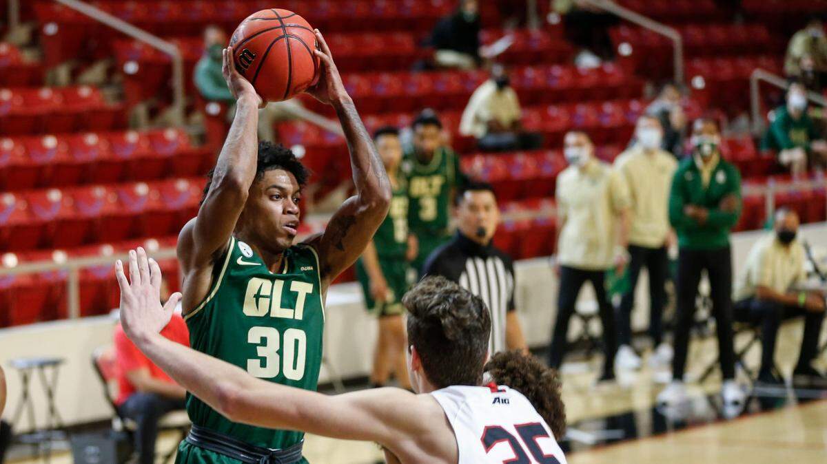 Charlotte guard Jhery Matos (30) looks to pass over Davidson forward Luka Brajkovic (35) during a game last month at Davidson. The 49ers are 6-6 entering their road trip to Florida Atlantic.