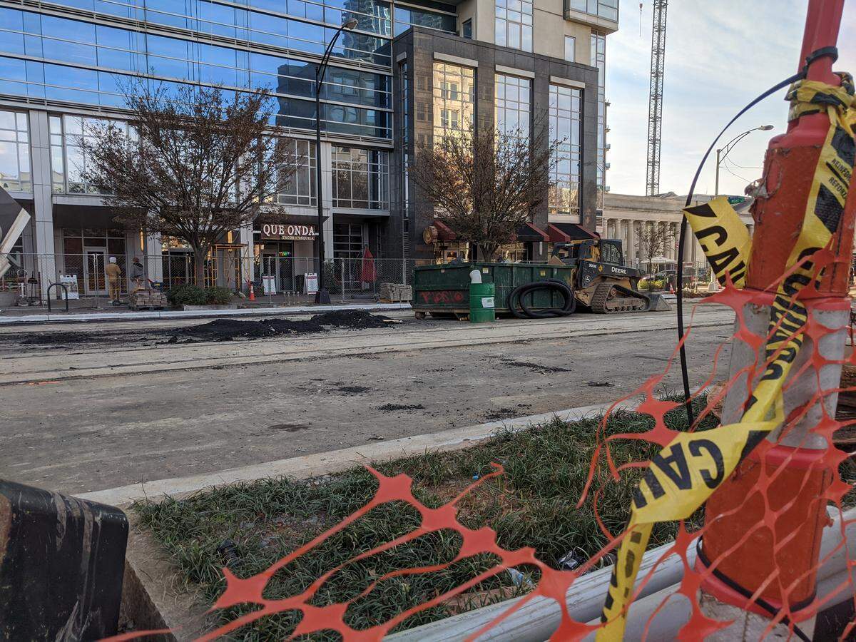 The CityLynx Gold Line streetcar construction has closed Trade Street to traffic in front of businesses like Que Onda.
