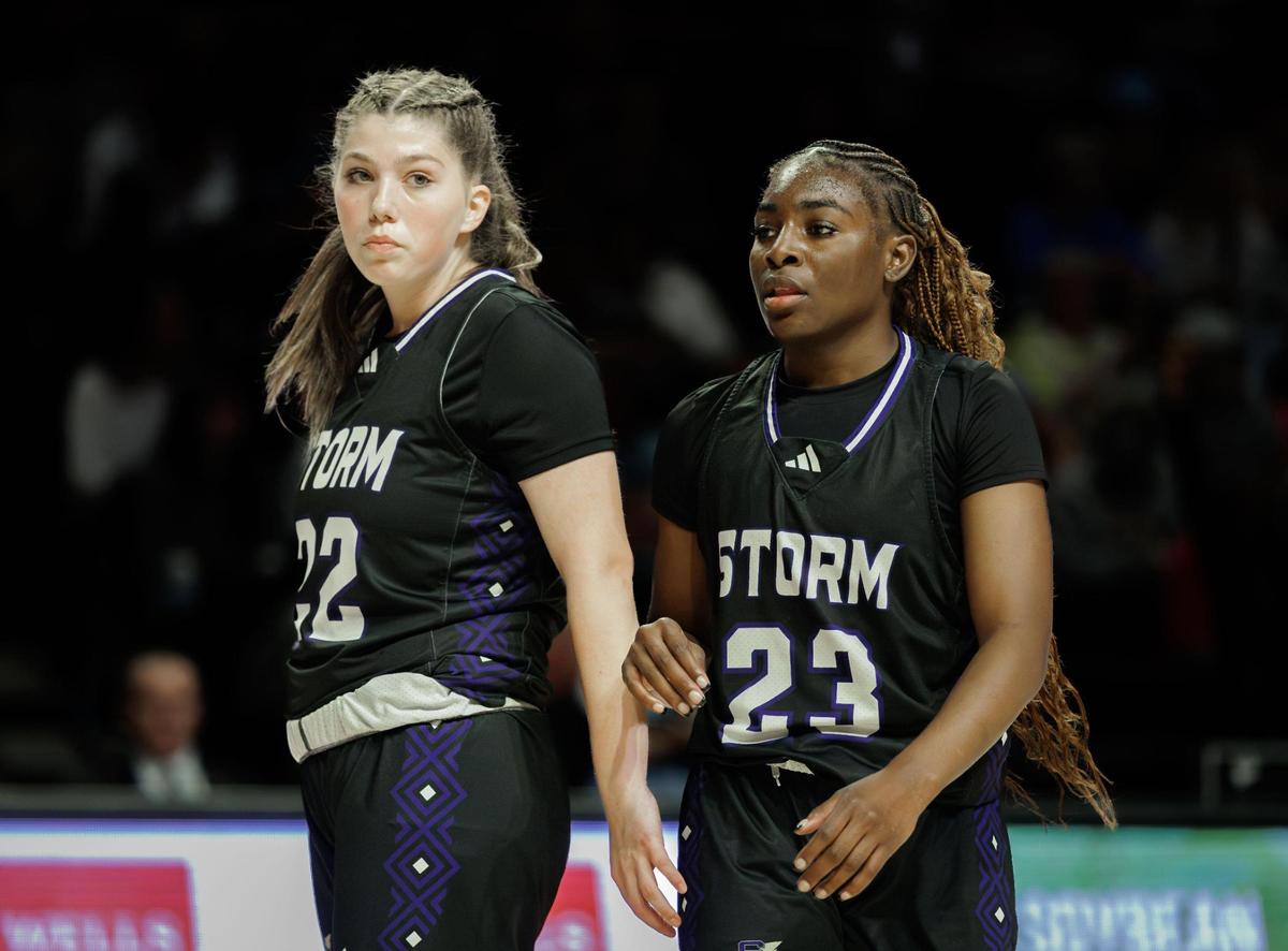 Stuart Cramer’s Oshauna Holland (23) and Ileigh Black (22) gather at center court after a timeout. Stuart Cramer would play Western Alamance in the 3A NCHSAA State Championship Friday March 14, 2025.