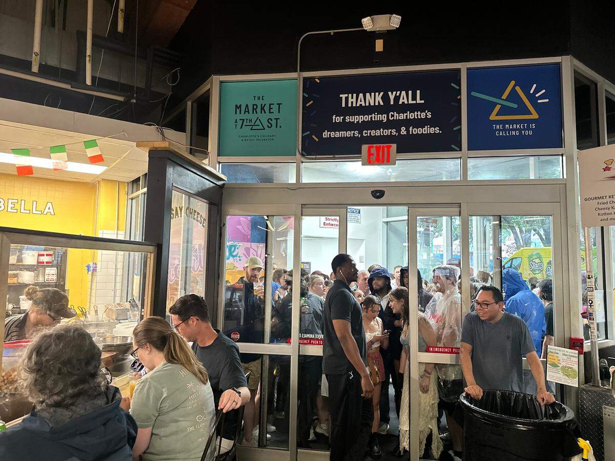 The Market at 7th Street reached capacity limits amid Lovin’ Live Music Festival concertgoers seeking shelter from the rain, leading staff to block more people from coming in the door.