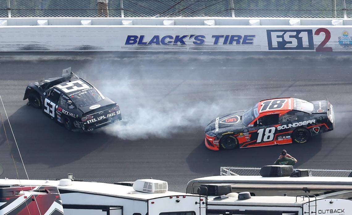 NASCAR Xfinity Series driver Katherine Legge, left, wrecks in Turn 2 ahead of driver William Sawalich, right, during the North Carolina Education Lottery 250 at Rockingham Speedway on Saturday, April 19, 2025.