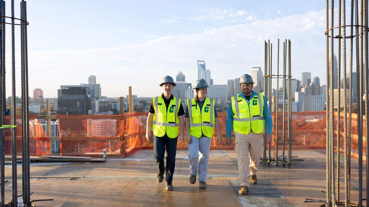UNC Charlotte engineering students at a construction site outside of uptown Charlotte. The university is launching a new construction-specific school.