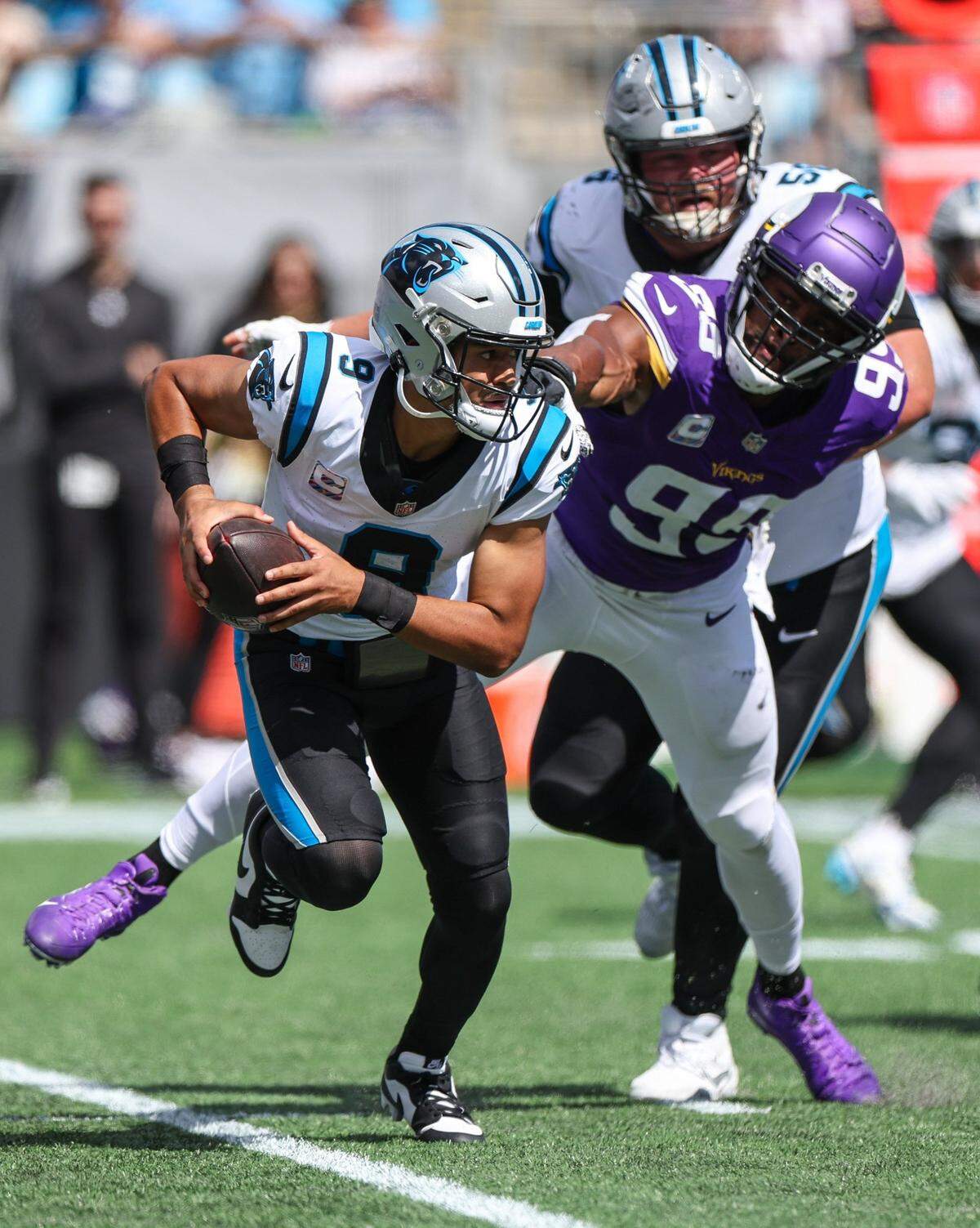Panthers quarterback Bryce Young, left, escapes the grasp of Minnesota outside linebacker Danielle Hunter, right, during the game at Bank of America Stadium on Sunday, October 1, 2023 in Charlotte, NC.