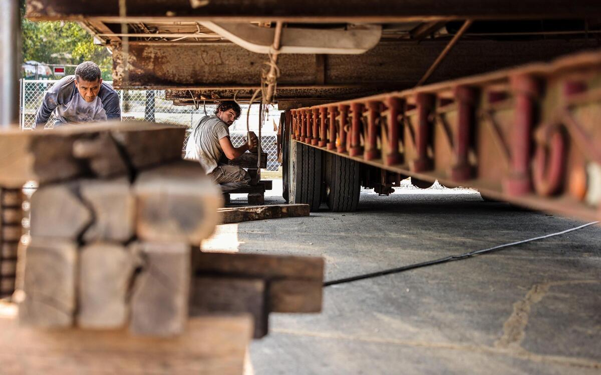 Mattie’s Diner is taken off a truck bed using a hydraulic lift at its new location at the corner of The Plaza and Shamrock Drive in Charlotte, N.C., on Monday, September 13, 2021.