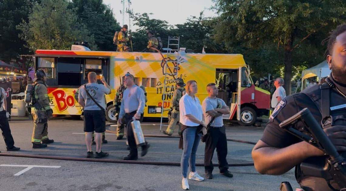 Firefighters work on a Bojangles food truck after it caught on fire at Lovin’ Life Music Fest in Charlotte on May 4, 2025.