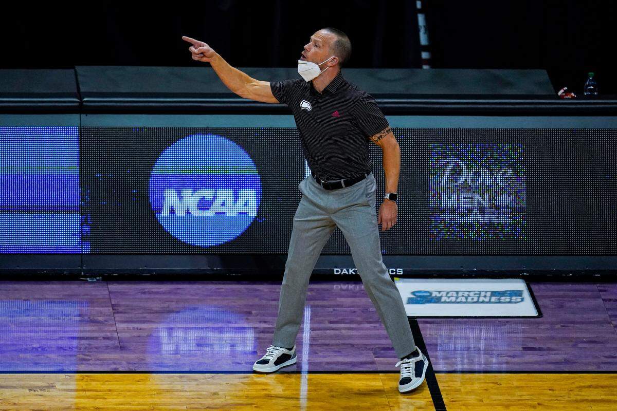 Winthrop head coach Pat Kelsey yells to his team as they played against Villanova in the first half of a first round game in the NCAA men’s college basketball tournament at Farmers Coliseum in Indianapolis, Friday, March 19, 2021. (AP Photo/Michael Conroy)