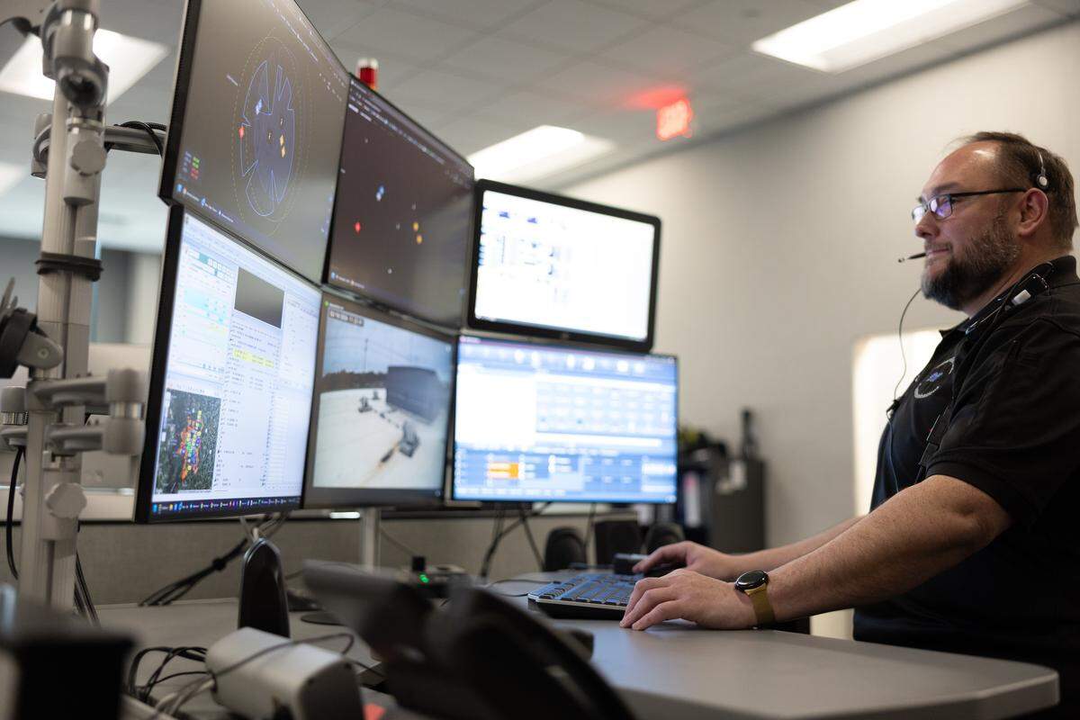 A dispatcher demonstrates sending out a drone during a media demonstration of the newly launched drone first responder program at Mooresville Police Department in Mooresville, N.C., on Wednesday, February 18, 2026.