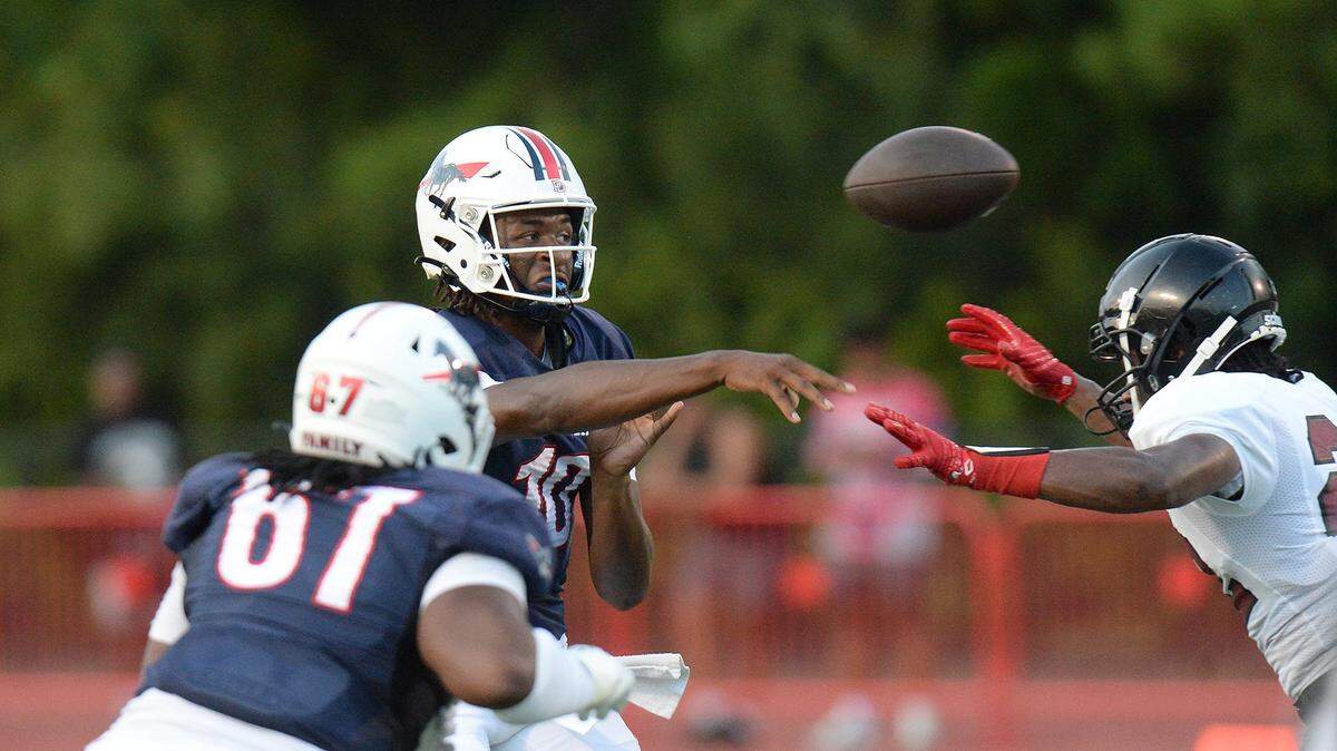 Providence Day quarterback #10, Zaid Lott, fires the ball under pressure in the first half Friday against Trinity Christian.
Providence Day lead Trinity Christian 27-8 at the end of the first half.
The Trinity Christian Crusaders came to Charlotte from Fayetteville, N.C. to face off against the nationally ranked Providence Day School Chargers in the first game of the high school football season on Friday, August 16, 2024.