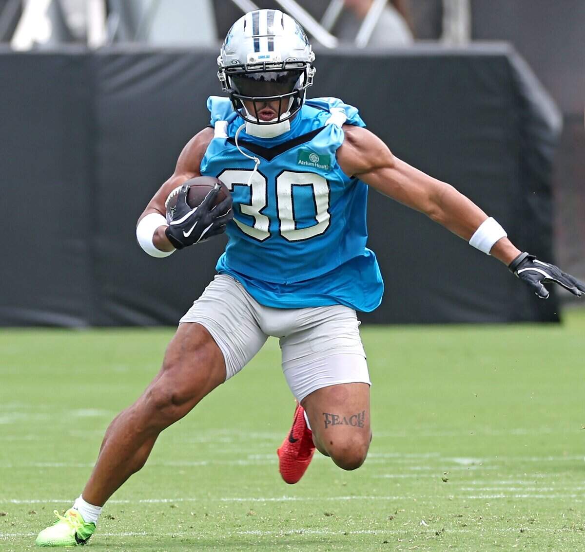 Carolina Panthers running back Chuba Hubbard breaks into the open field on a run during a mandatory minicamp practice on Wednesday, June 10, 2026.