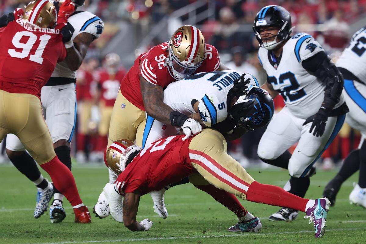 Carolina Panthers running back Rico Dowdle is tackled by Jordan Elliott (92) of the San Francisco 49ers in Monday’s first quarter at Levi’s Stadium.