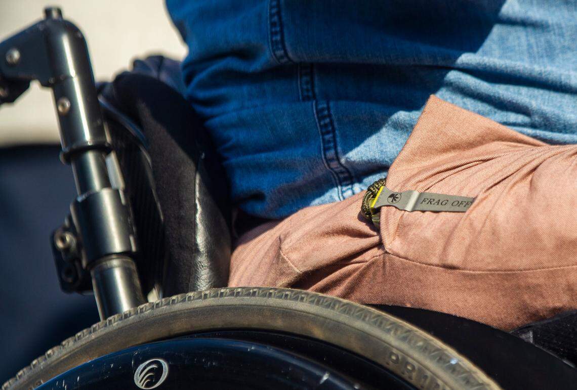 U.S. Rep. Madison Cawthorn appears to have a Frag Off brand knife in his right front pants pocket while speaking to a crowd rallying against mask requirements outside a Johnston County school board meeting Tuesday, Sept. 14, 2021.