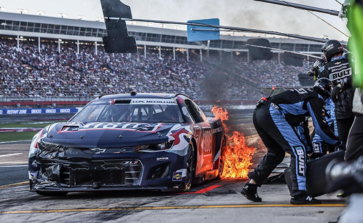 Corey LaJoie’s car catches fire during a pit stop at the Coca-Cola 600 in Concord, N.C., on Sunday, May 29, 2022.