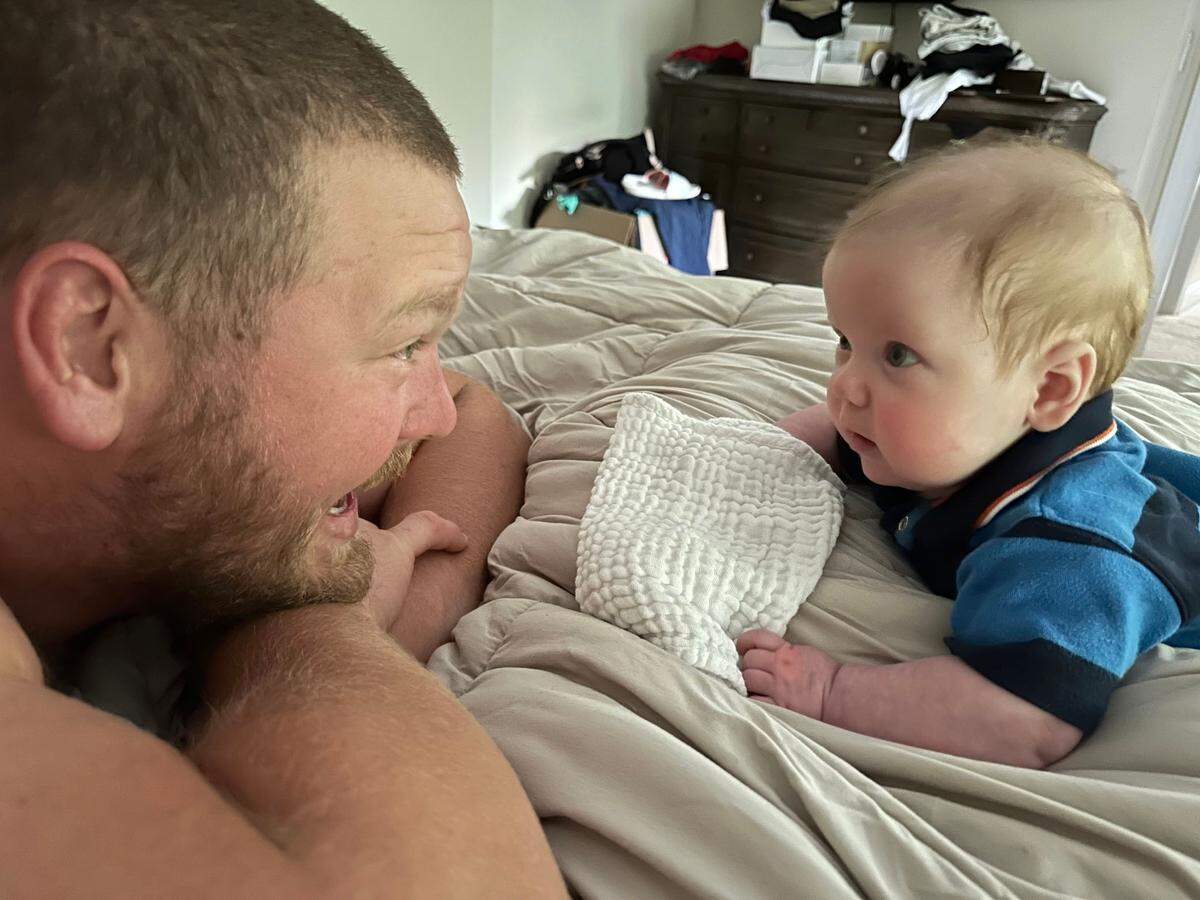 Carolina Panthers center Bradley Bozeman and his son, Brody, smile at each other while spending some quality time together. Bozeman typically wakes up with Brody to spend time with him before heading to Bank of America Stadium for work. (Courtesy of Nikki Bozeman)
