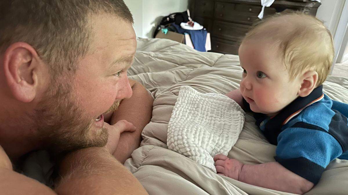 Carolina Panthers center Bradley Bozeman and his son, Brody, smile at each other while spending some quality time together. Bozeman typically wakes up with Brody to spend time with him before heading to Bank of America Stadium for work. (Courtesy of Nikki Bozeman)
