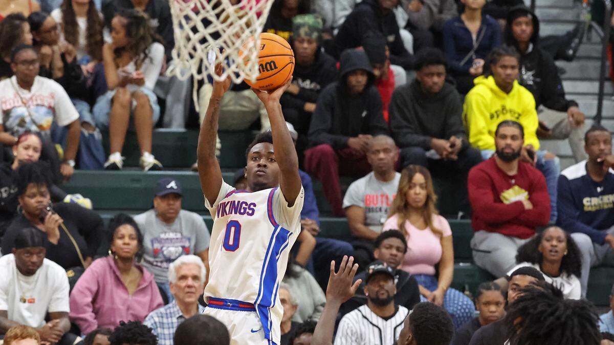 North Meck’s DJ Lindsey Jr., releases a jump shot over the West Charlotte defense during the Power Six Conference Tournament action on Friday at Independence High School.