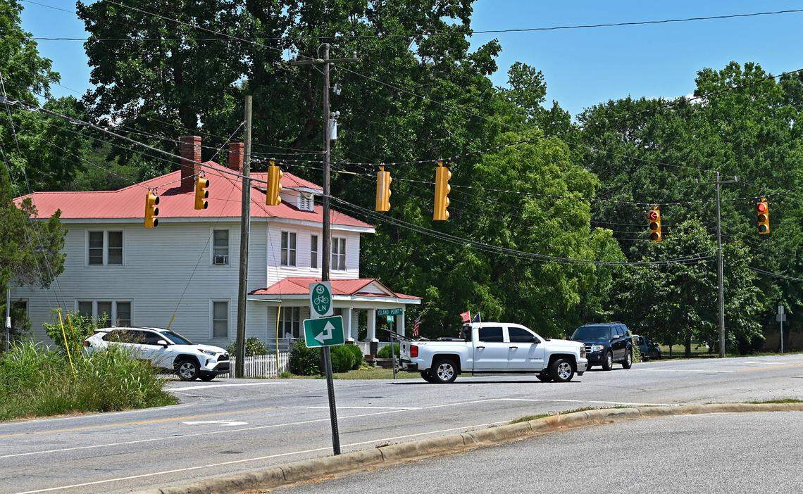 Traffic navigates the intersection of Island Point Road and Sherrills Ford Road in Catawba County on Tuesday, June 25, 2024. Sherrills Ford Elementary School is located at the intersection.