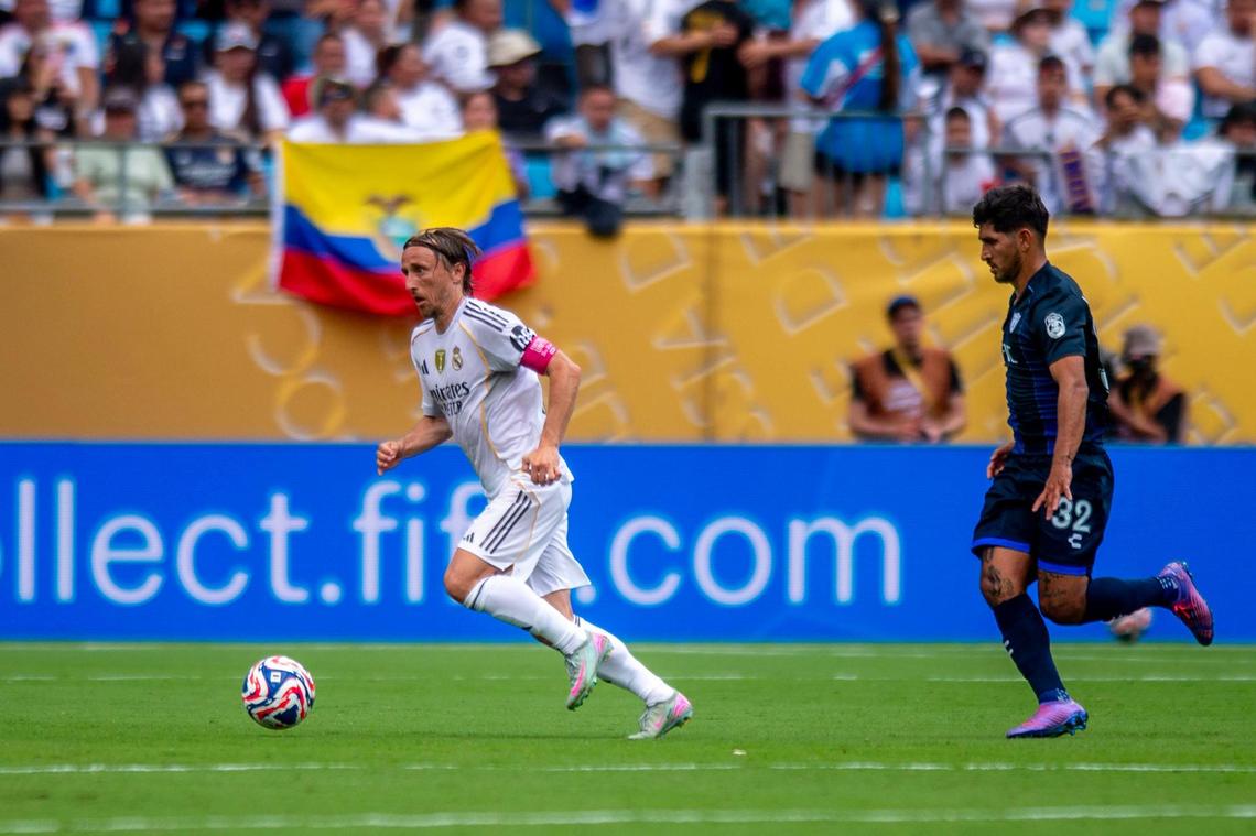 Luka Modric dribbles the ball away from a Pachuca player during the FIFA Club World Cup game between Real Madrid and Pachuca in Charlotte, NC, Sunday, June 22, 2025.
