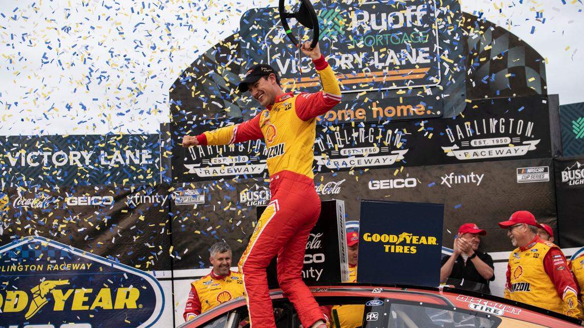 Joey Logano celebrates in Victory Lane after winning a NASCAR Cup Series auto race at Darlington Raceway, Sunday, May 8, 2022, in Darlington, S.C. (AP Photo/Matt Kelley)
