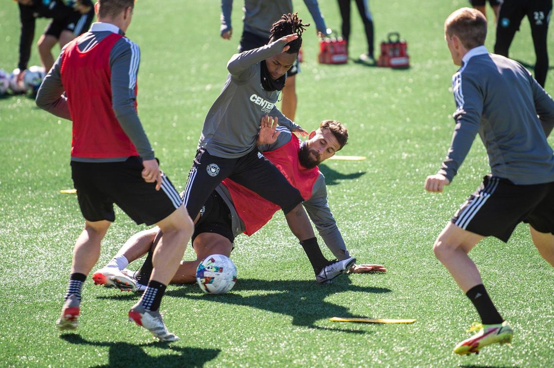 Charlotte FC’s Yordy Reyna, second from left, and Guzman Corujo, battle for possession of the ball in a drill during an open training session at Bank of America Stadium on Thursday, February 10, 2022 in Charlotte, NC.