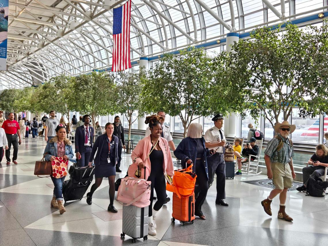 Passengers at Charlotte Douglas International Airport travel through the terminal during the 4th of July travel period. New tech from American Airlines at CLT helps ensure they won’t miss connecting flights.