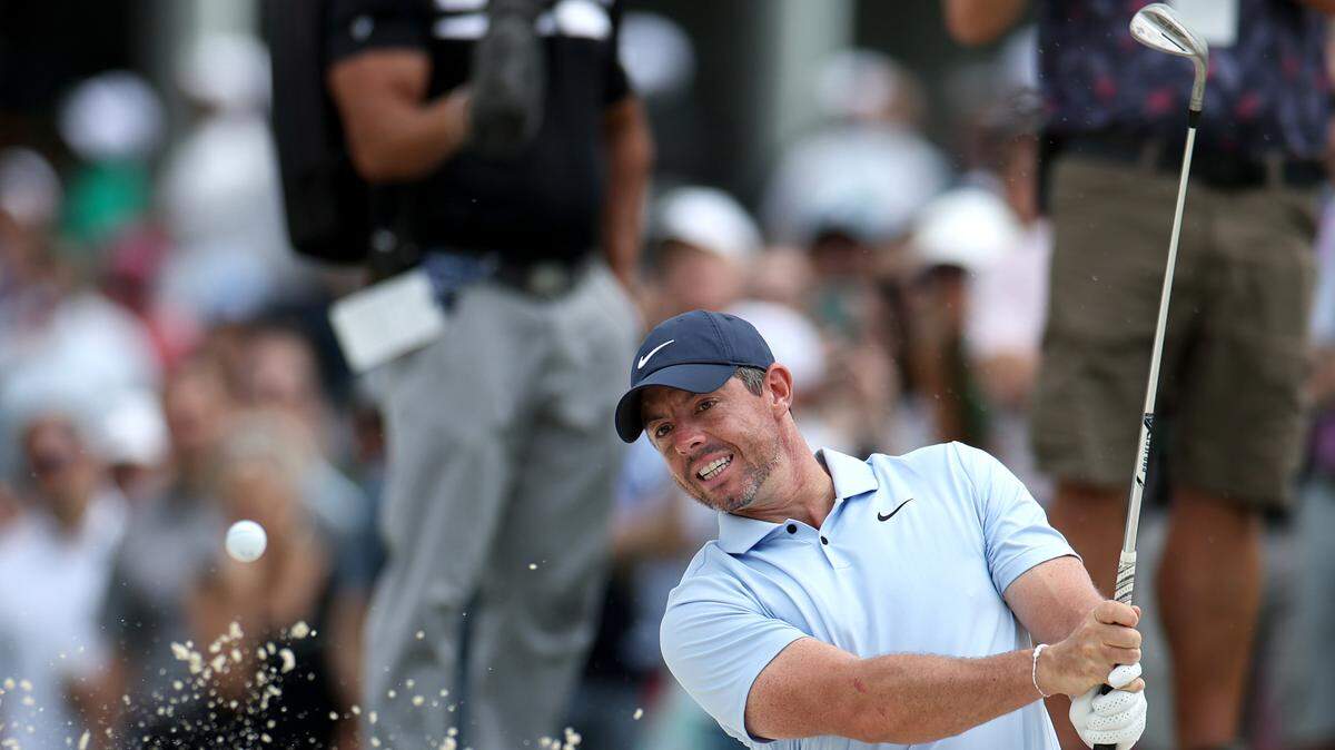 Rory McIlroy watches his ball clear the rim of a sand trap at the 10th green during second-round action of the Wells Fargo Championship at Quail Hollow Club in Charlotte, NC on Friday, May 10, 2024.