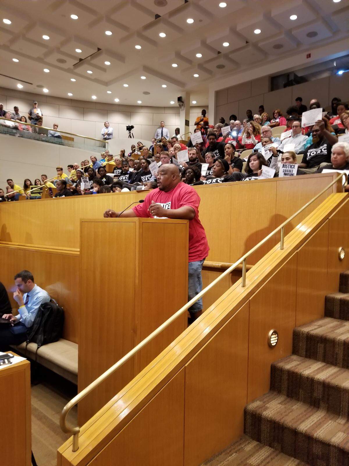 LSG Chefs employee Sylvester King tells the City Council that while American Airlines is very profitable, he makes $9.85 an hour and lives with friends.