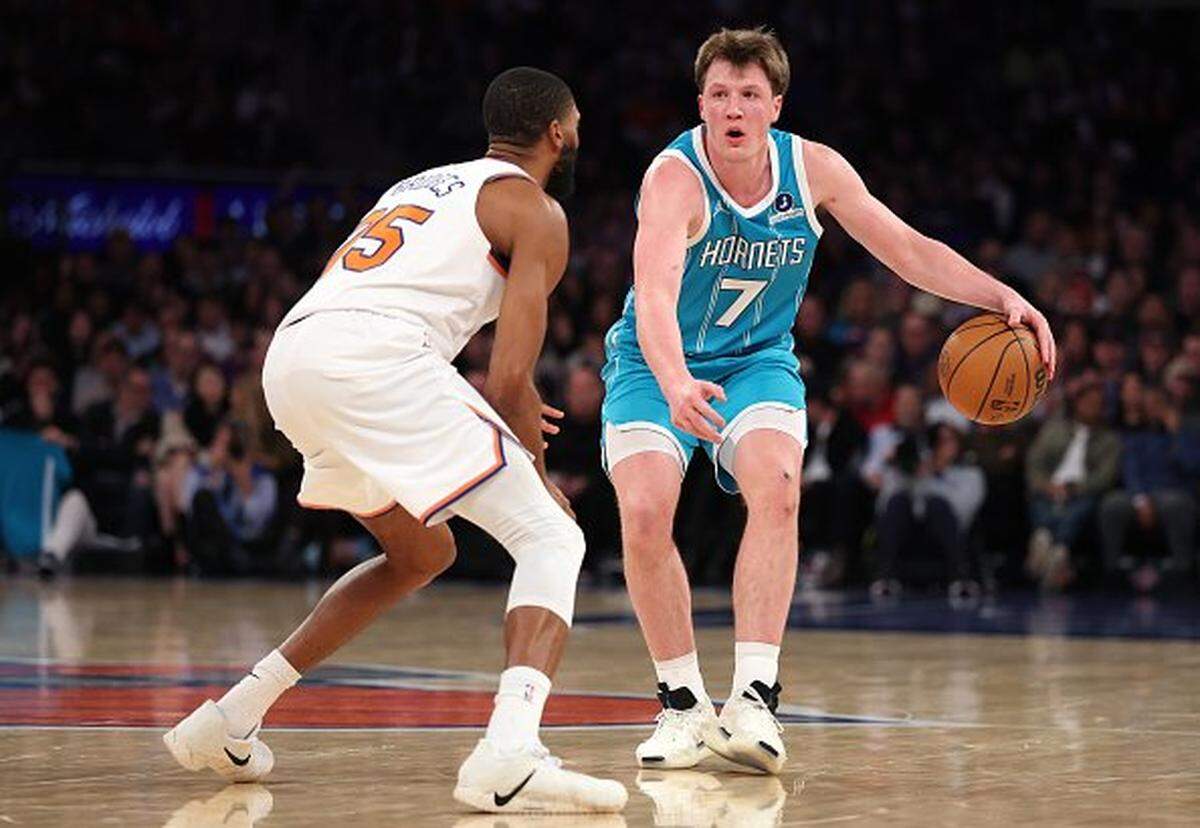 Kon Knueppel of the Charlotte Hornets in action against Mikal Bridges of the New York Knicks  during their game at Madison Square Garden.