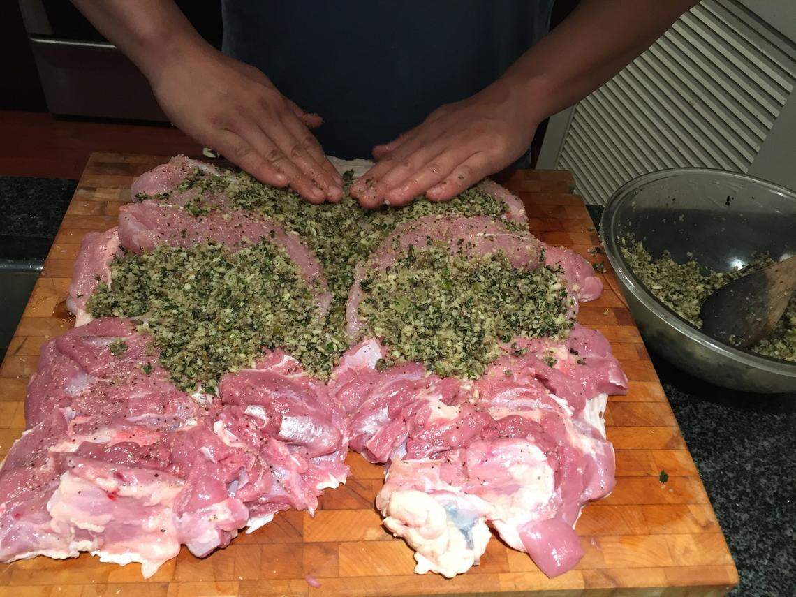 Joe Huang, owner of Bang Bang Burgers, debones a turkey to ensure even cooking and retaining moisture.