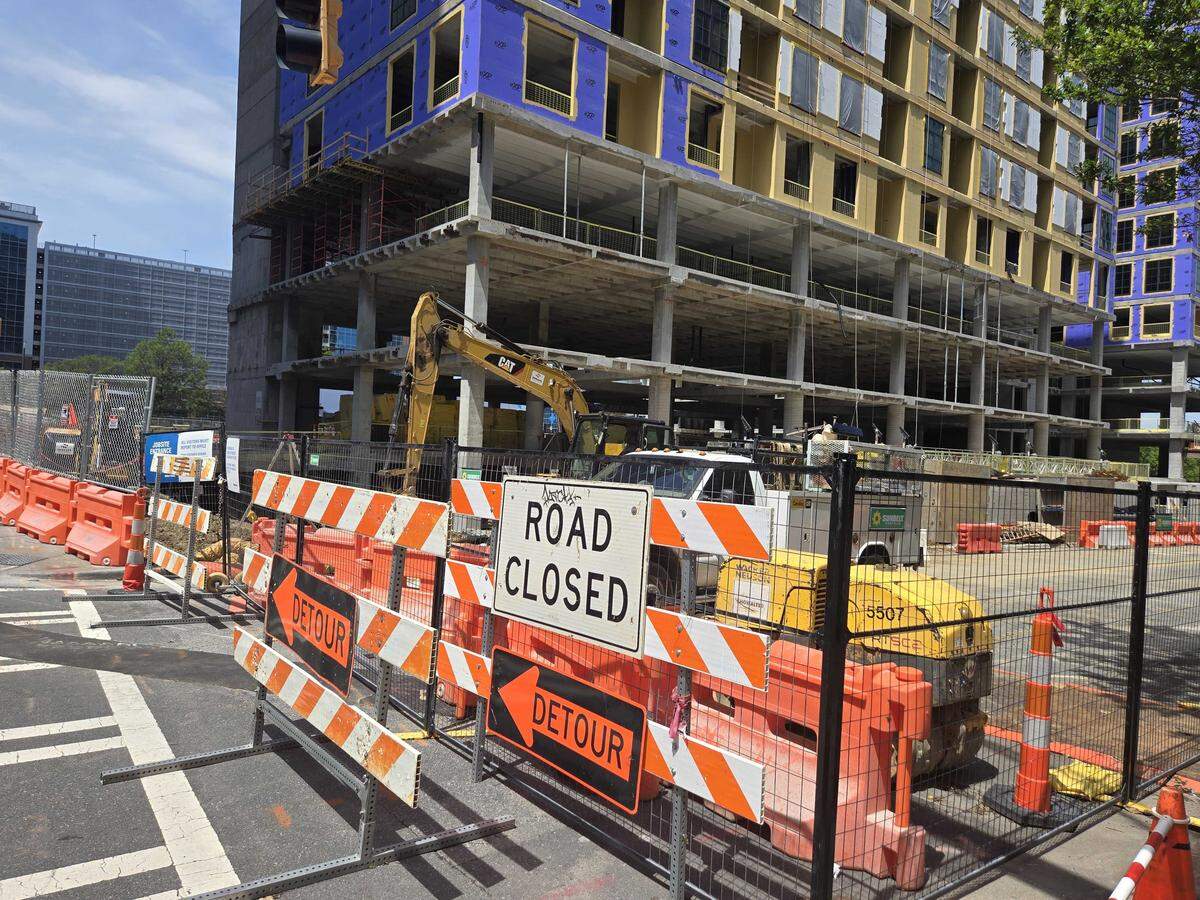 A road closure diverts traffic near the construction site at the former Duke Energy headquarters. The site will include loft-style apartments and a retail center when construction is complete.