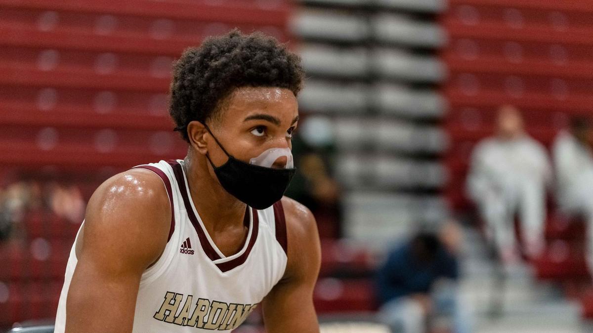 Harding’s Logan Blair (5) takes a rest during a 2nd quarter timeout. Harding would host West Meck Wednesday February 17, 2021.