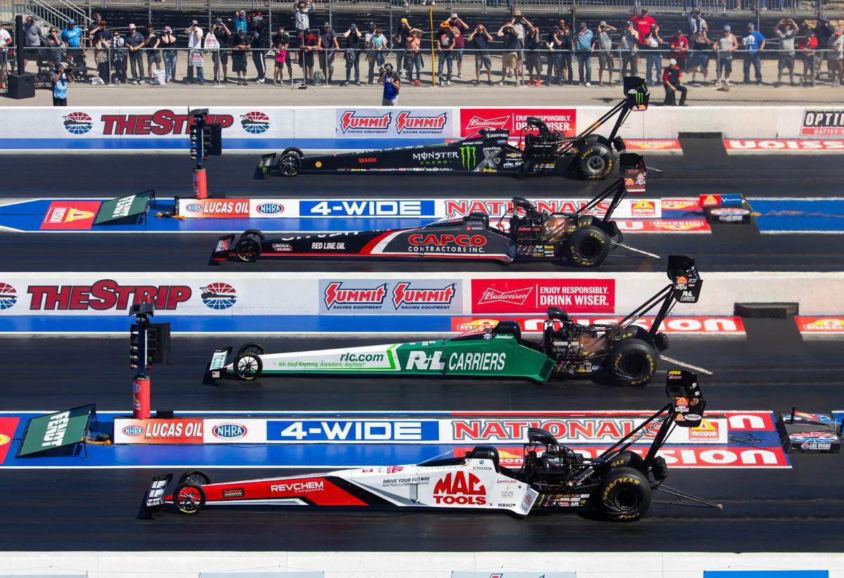 Apr 14, 2024; Las Vegas, NV, USA; NHRA top fuel drivers (from top) Brittany Force races alongside Steve Torrence, Josh Hart and Doug Kalitta during the 4 Wide Nationals at The Strip at Las Vegas Motor Speedway.