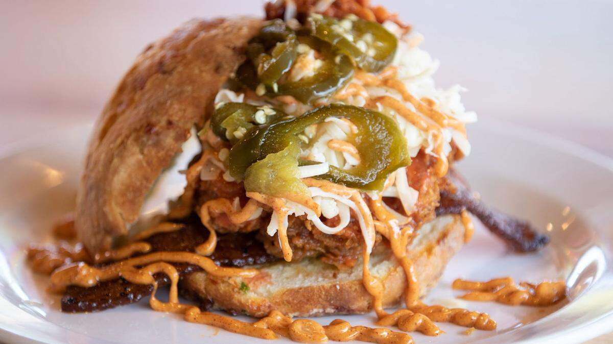 Vicious Biscuit, based in the Charleston area, is hiring as construction continues at The Aboretum site in Charlotte. The menu includes “The Vicious,” a cheddar and jalapeño biscuit, crispy fried chicken breast, maple sausage gravy, house cowboy candy, and a maple syrup drizzle.