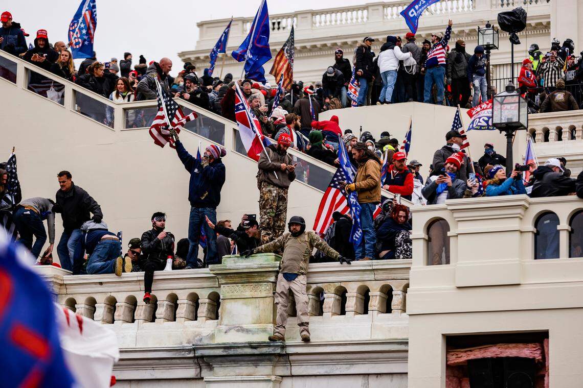 Pro-Trump supporters storm the U.S. Capitol following a rally with President Donald Trump on Wednesday, Jan. 6, 2021 in Washington, D.C. Congress held a joint session today to ratify President-elect Joe Biden’s 306-232 Electoral College win over President Donald Trump. A group of Republican senators said they would reject the Electoral College votes of several states unless Congress appointed a commission to audit the election results.