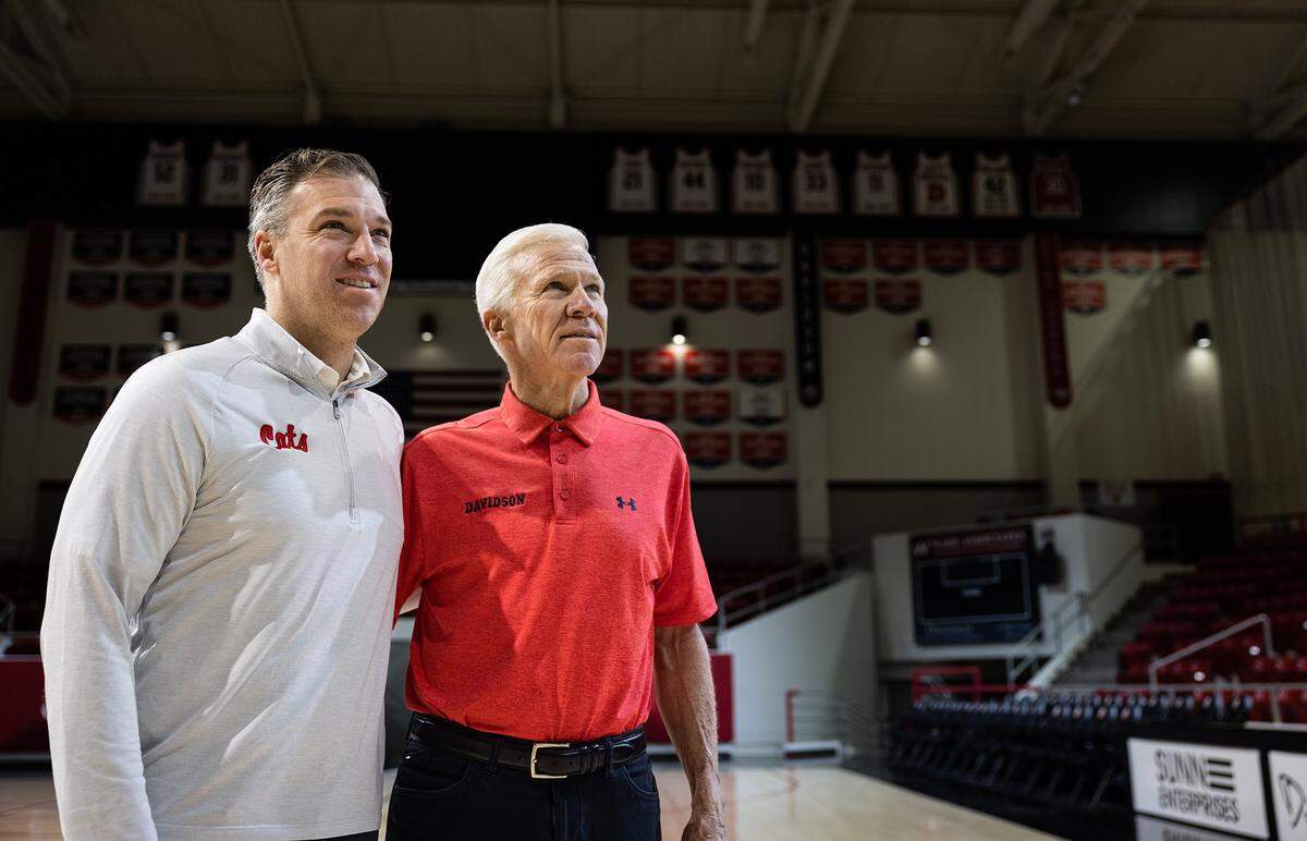 Matt McKillop, left, and his dad, Bob, pose for a portrait at John M. Belk Arena in Davidson, N.C., on Wednesday, February 8, 2023.