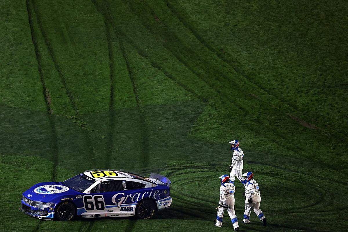 Casey Mears, driver of the #66 SI Yachts/Gracie Foundation Ford, exits the infield grass after an on-track incident during Duel 1 for the NASCAR Cup Series Daytona 500 at Daytona at Daytona International Speedway on February 12, 2026 in Daytona Beach, Florida. That put him down a lap — and was the precursor to a remarkable comeback. 