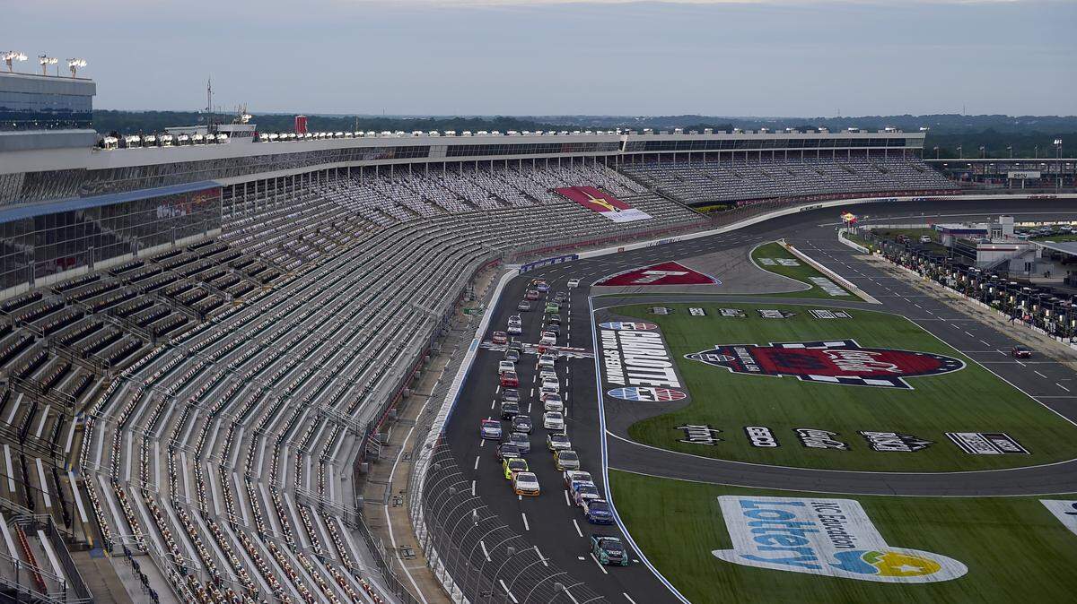 Ben Rhodes, driver of the #99 Tenda Heal Ford, leads the field to starts the North Carolina Education Lottery 200 at Charlotte Motor Speedway last year.
