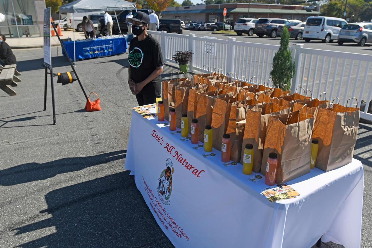 Denise Hairston of Dee’s Vegan To Go, gives away vegan treats during a StreetEats event on Thursday.
