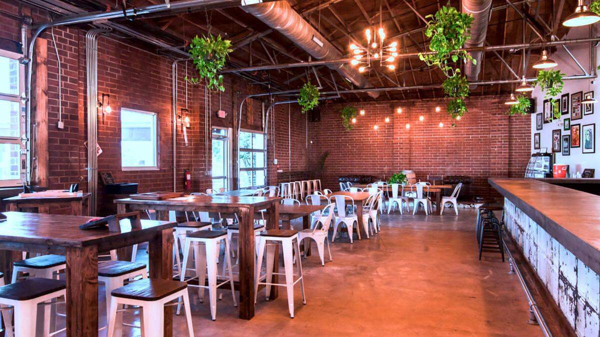 While many restaurants reopened on Friday, May 22 following Gov. Cooper’s Phase 2 announcement, some restaurants and breweries will remain closed to dine-in and patio service for the time being. Shown above is Divine Barrel Brewing.