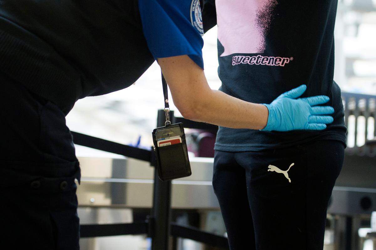 Under Transportation Security Administration policy for groin searches, agents may briefly slide the side or back of their hands near or across the genitals of men or women.