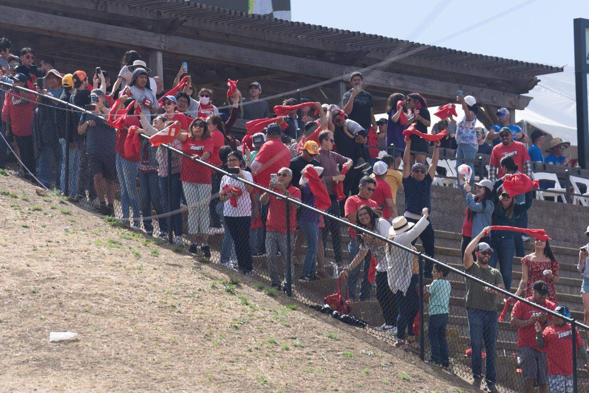 Jun 12, 2022; Sonoma, California, USA; Fans cheer when NASCAR Cup Series driver Daniel Suarez (99) won the NASCAR Toyota - Save Mart 350 race event at Sonoma Raceway.