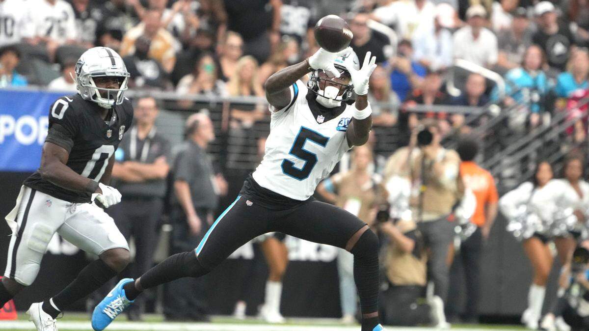 Carolina Panthers wide receiver Diontae Johnson (5) catches the ball against Las Vegas Raiders cornerback Jakorian Bennett (0) in the first half at Allegiant Stadium in Las Vegas Sunday.