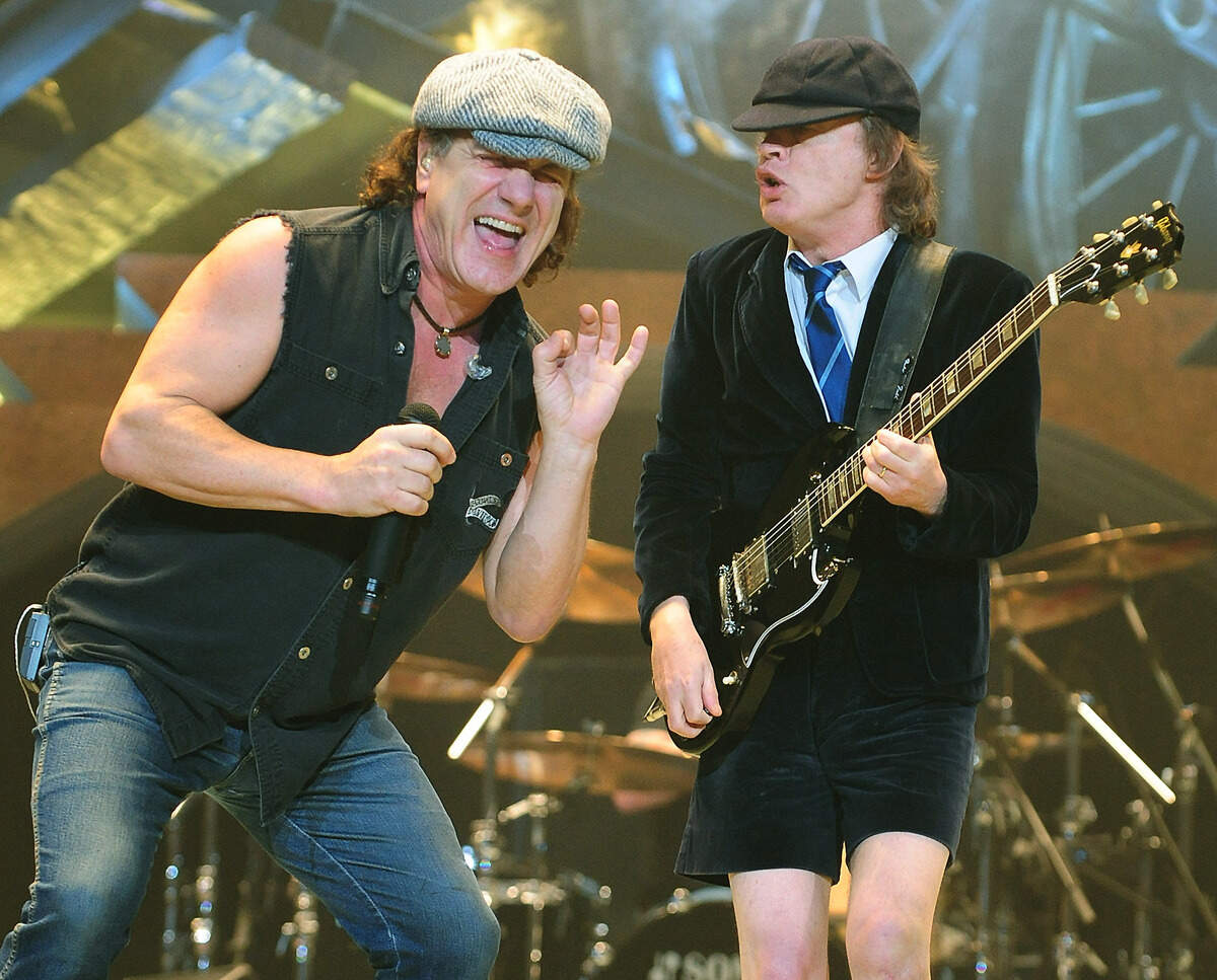 12/18/08 AC/DC lead singer Brian Johnson and guitarist Angus Young perform one of the band’s songs Thursday night at Time Warner Cable Arena in Charlotte, NC. JEFF SINER - jsiner@charlotteobserver.com