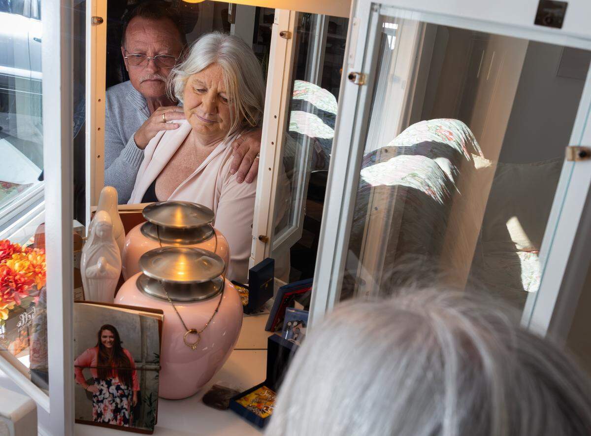 Debora Savage, right, and her husband look at a memorial to their daughter Tylor at their Mooresville home. Tylor died at age 26 within days of being operated on by Dr. Timothy Ryan Heider, a bariatric surgeon.