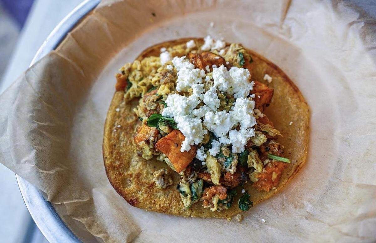 The ‘Mamas Favorite’ breakfast from Taco Billy made with sausage, eggs, spinach, sweet potato, and goat cheese on a plantain tortilla.