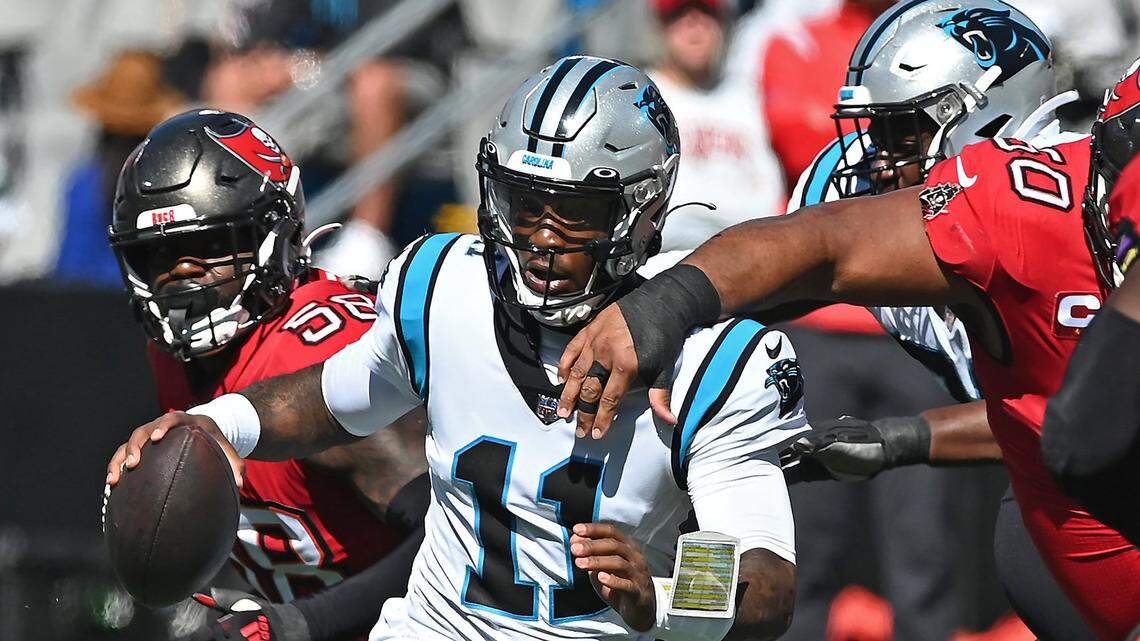 Carolina Panthers quarterback PJ Walker begins to try and scramble out of the pocket as the Tampa Bay Buccaneers defense converges during action at Bank of America Stadium in Charlotte, NC on Sunday, October 23, 2022. The Panthers defeated the Buccaneers 21-3.