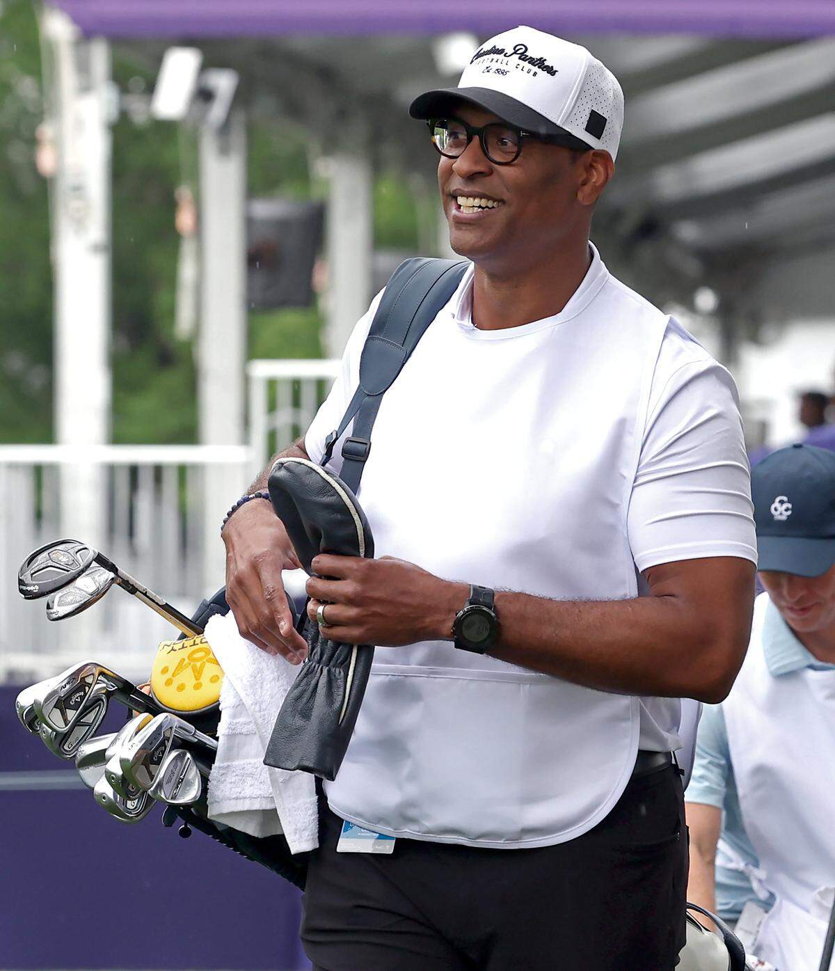 Former Carolina Panthers defensive end Mike Rucker serves as former tight end Wesley Walls caddie during the Truist Championship Pro-Am at Quail Hollow Club in Charlotte, NC on Wednesday, May 6, 2026.