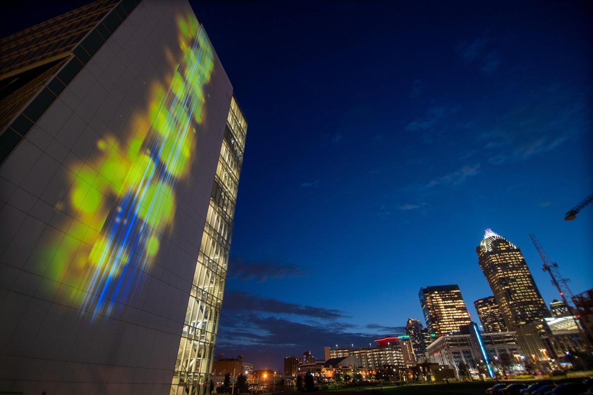 Particle Falls is a real-time data collection of particle pollution displayed in a light exhibit on the side of the UNC Charlotte Center City Building.